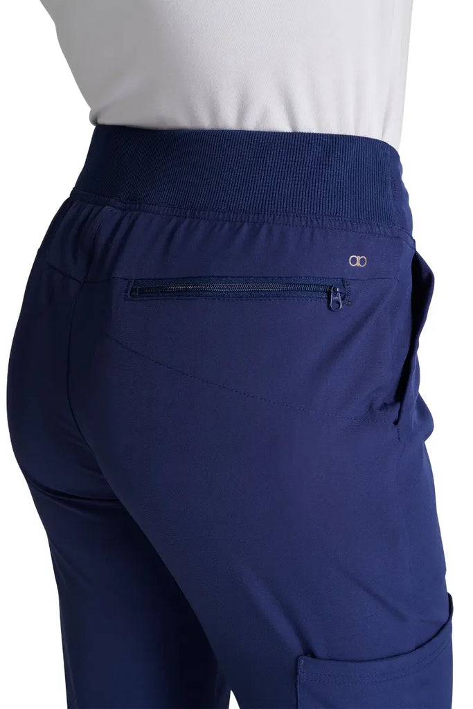 A close look at the back in-seam security zip pocket on the Allura Women's High Waist Gusset Scrub Jogger in Navy. 