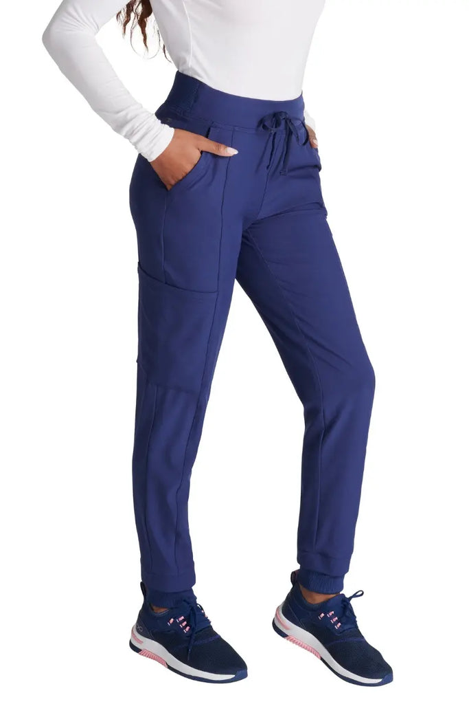 The Allura Women's High Gusset Scrub Jogger in Navy featuring two roomy front angled pockets.