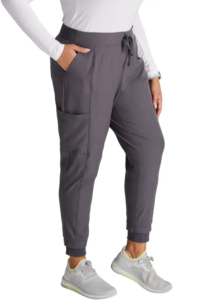 The Allura Women's High Gusset Scrub Jogger in Pewter featuring two roomy front angled pockets.