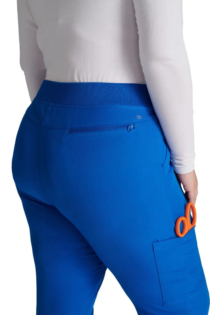 A close look at the back in-seam security zip pocket on the Allura Women's High Waist Gusset Scrub Jogger in Royal.