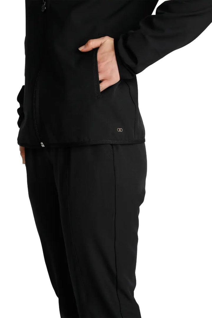 A close look at the front welt pockets on the Allura Women's Zip-Up Scrub Jacket in Black.