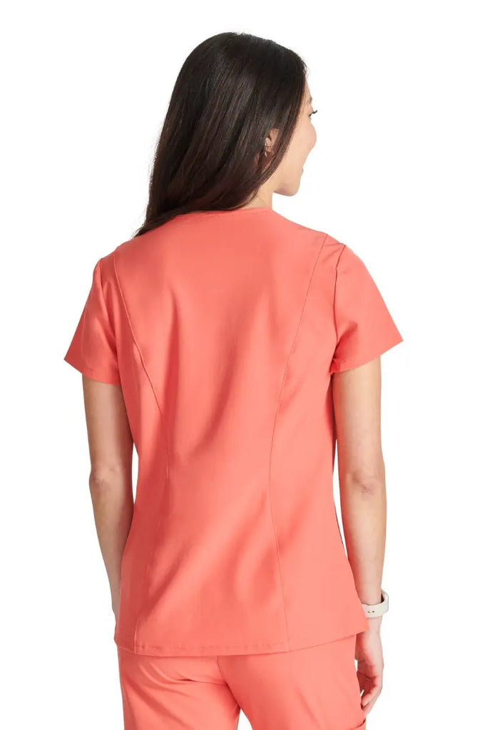The back of the Allura Women's Mitered V-Neck Scrub Top in Cayenne featuring a center back length of 25".