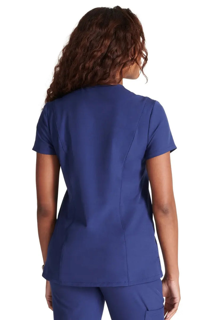 The back of the Allura Women's Mitered V-Neck Scrub Top in Navy featuring a center back length of 25".