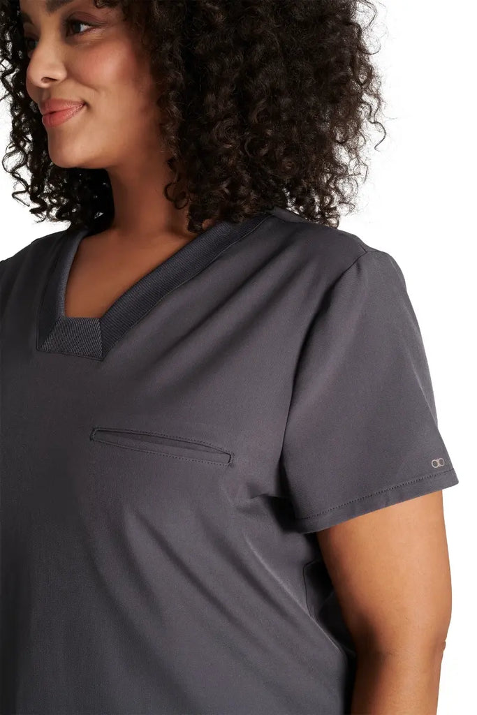 A close look at the mitered neckline and rib knit trim on the Allura Women's V-neck Scrub Top in Pewter.