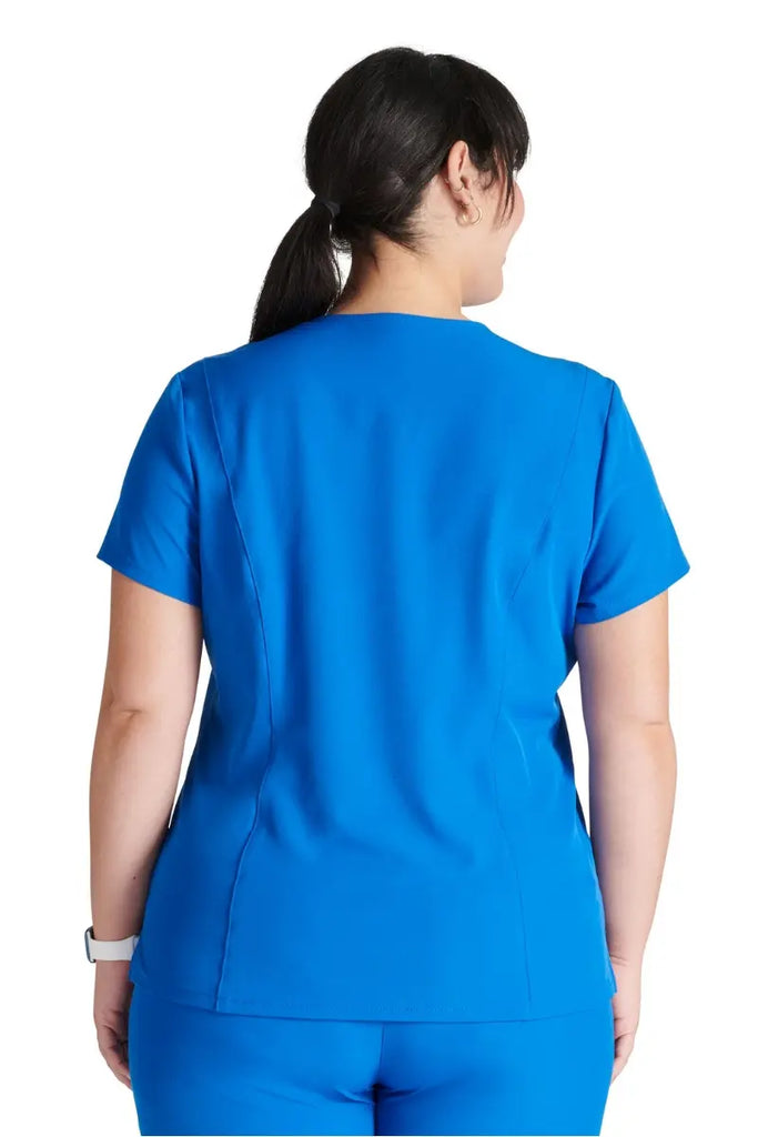The back of the Allura Women's Mitered V-Neck Scrub Top in Royal featuring a center back length of 25".