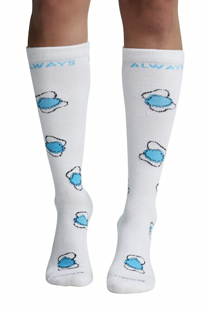 The front of the Cherokee Women's Knee High Compression Socks in Always Essential featuring a cute print of light blue face masks on a white background.