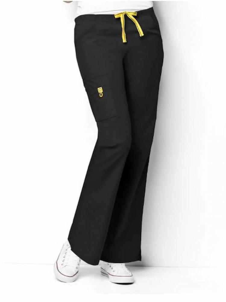 A female Physical Therapist's Assistant wearing a pair of the WonderWink Origins Women's Romeo Cargo Scrub Pants in Black size 5Xl featuring 1 right cargo WonderWink signature triple pocket with yellow bungee ID loop.