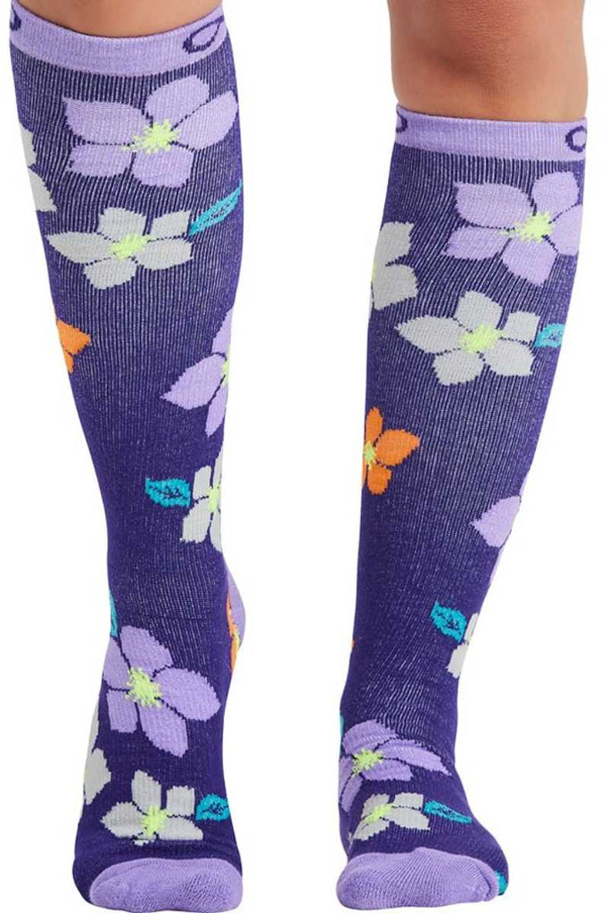 The front of the Infinity Women's Kickstart Compression Socks in Purple Bloom featuring a knee high fit with a moderate level of compression (15-20 mmHg) to help prevent fatigue and reduce swelling.