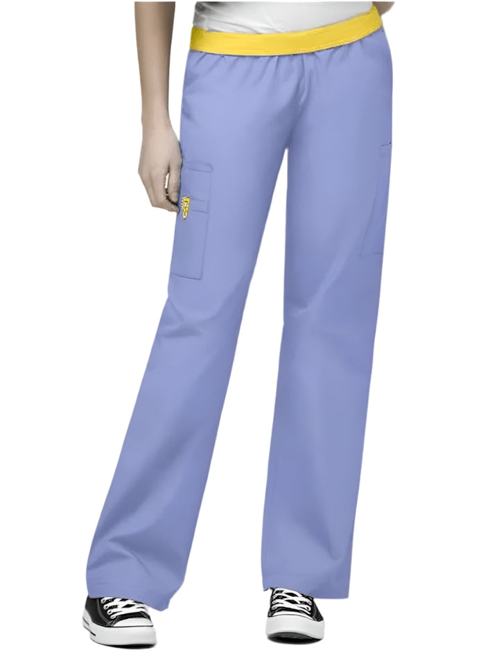 A young female Nurse Practitioner wearing a WonderWink Women's Elastic Waist Quebec Scrub Pant in Ceil size 3XL Tall.