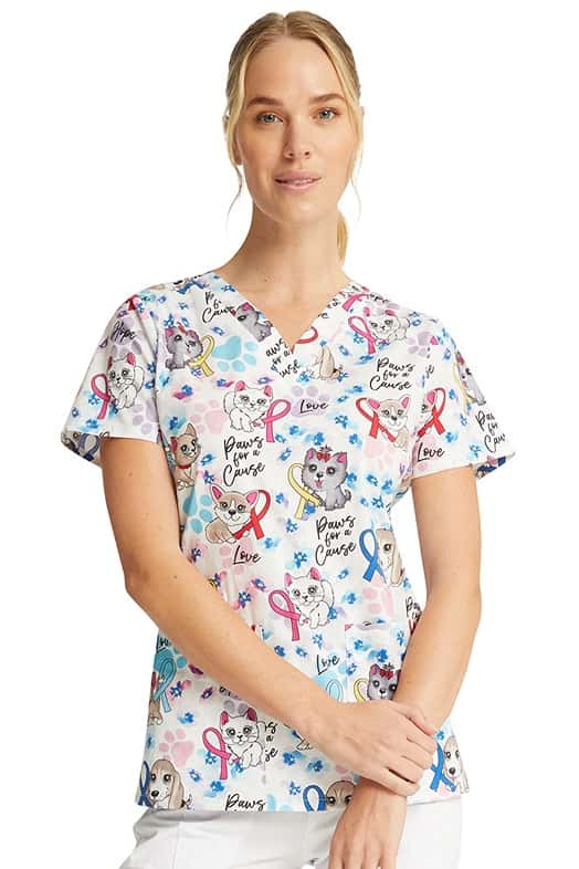 A female Home Care Registered Nurse wearing a Women's V-Neck Print Scrub Top from Cherokee Uniforms in "Paws for a Cause".
