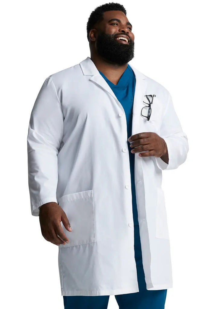 A young Male Physician wearing a Dickies Unisex EDS Signature Lab Coat in White size 3XL featuring two lower front patch pockets.