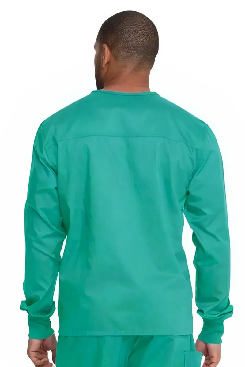 A young male Physician's Assistant showcasing the back of the Dickies Unisex Warm-Up Scrub Jacket in Surgical Green featuring a flattering silhouette for all body types.