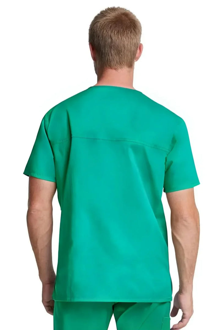 The back of the Dickies Industrial Unisex Tuckable V-Neck Scrub Top in Surgical Green size Small featuring a center back yoke to ensure a flattering fit for both men and women.