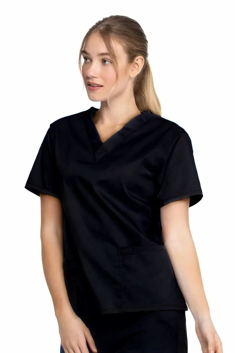 A young female Nurse wearing a Dickies Industrial Unisex V-Neck Scrub Top in Black size Medium featuring side slits for enhanced breathability and additional range of motion throughout the day.