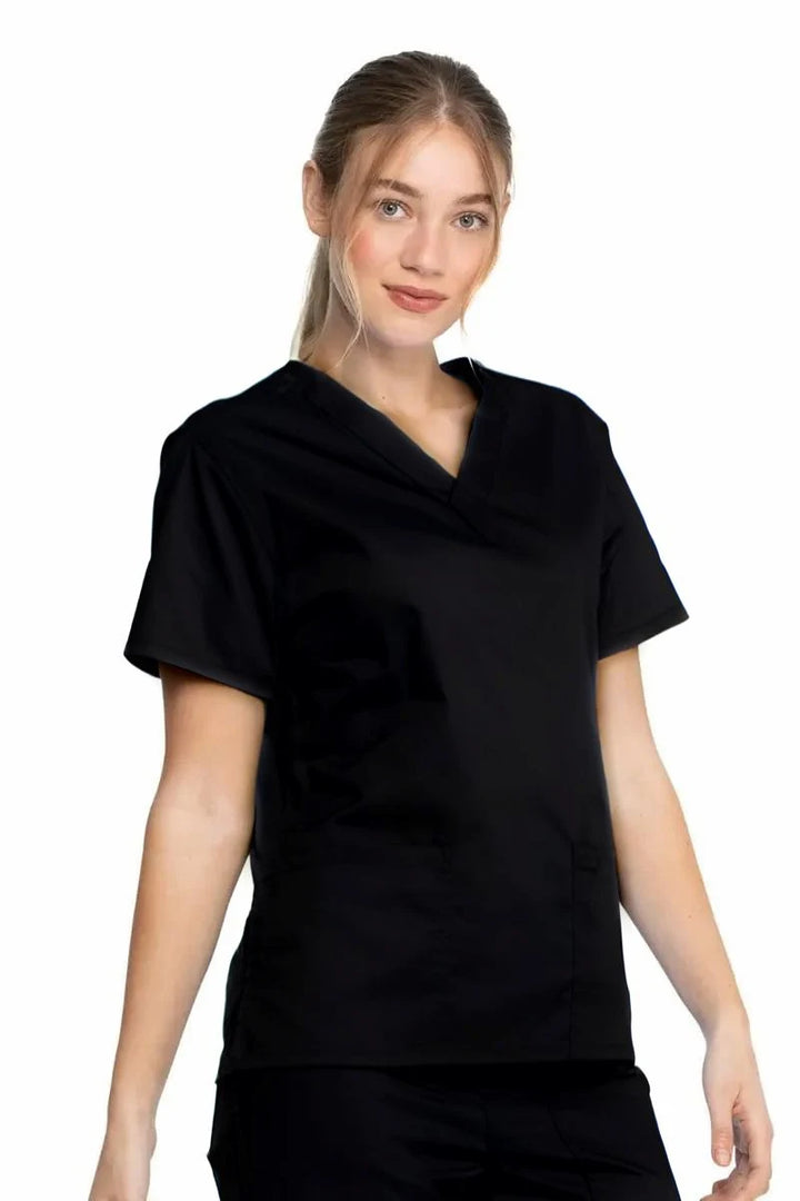 A young female Nurse Anesthetists wearing a Dickies Industrial Unisex V-Neck Scrub Top in Black size XS featuring a flattering fit that ensures a comfortable and professional fit for men and women. 