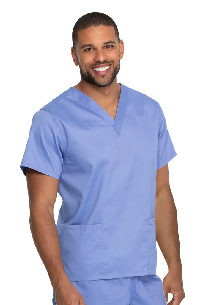 A male Physician's Assistant wearing a Dickies Industrial Unisex V-Neck Scrub Top in Ceil Blue size 4XL featuring reinforced seams at stress points to provide extra strength and prevent tearing.