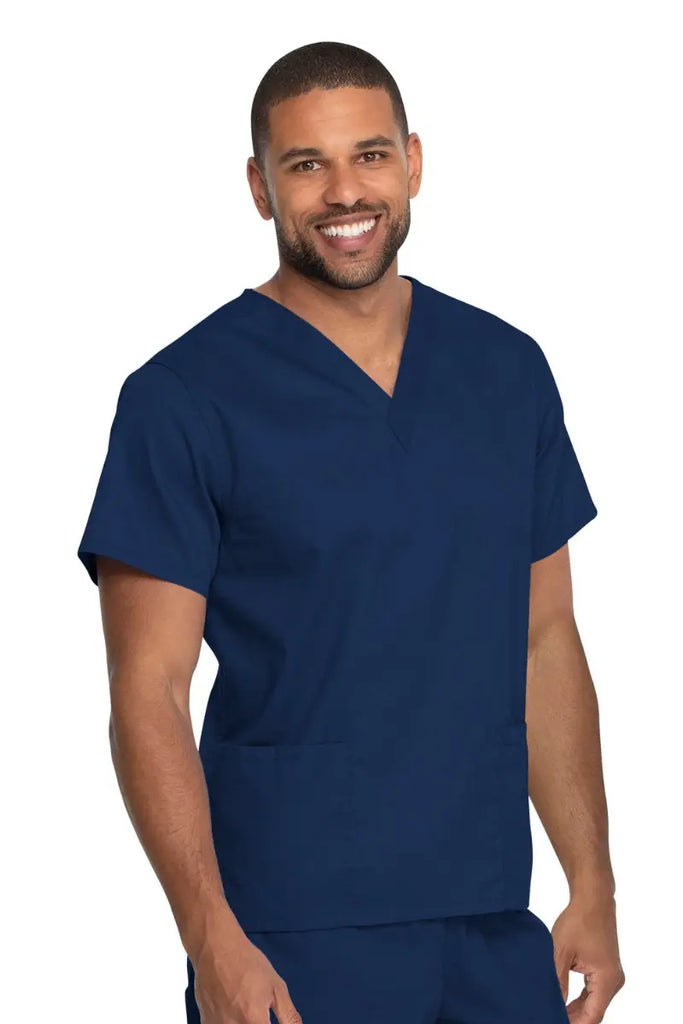 A male LPN wearing a Dickies Industrial Unisex V-Neck Scrub Top in Navy Blue size 4XL featuring reinforced seams at stress points to provide extra strength and prevent tearing.