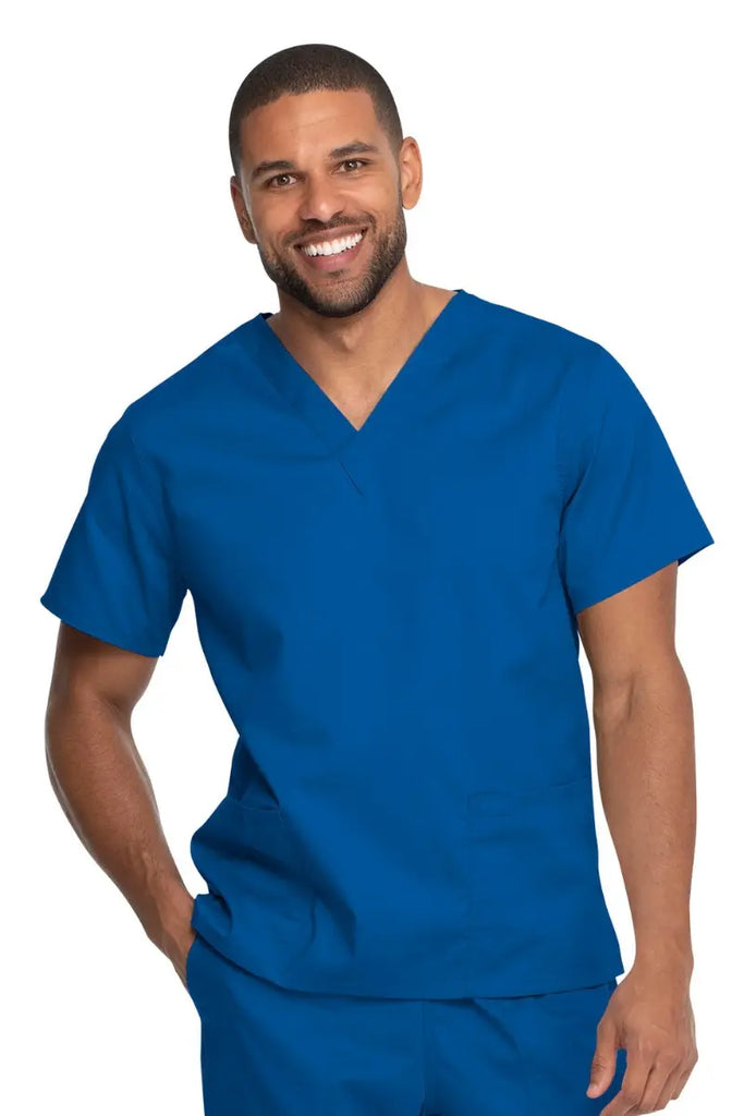 A young male Advanced Practice Provider wearing a Dickies Industrial Unisex V-Neck Scrub Top in Royal Blue size 5XL featuring a soft and breathable fabric that offers all-day comfort.