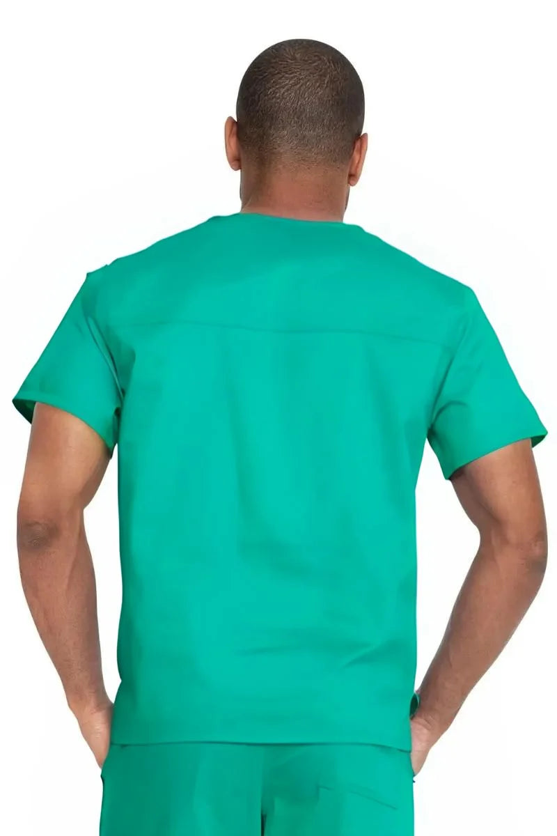 A male Scrub Nurse wearing a Dickies Industrial Unisex V-Neck Scrub Top in Surgical Green size 4XL featuring reinforced seams at stress points to provide extra strength and prevent tearing.