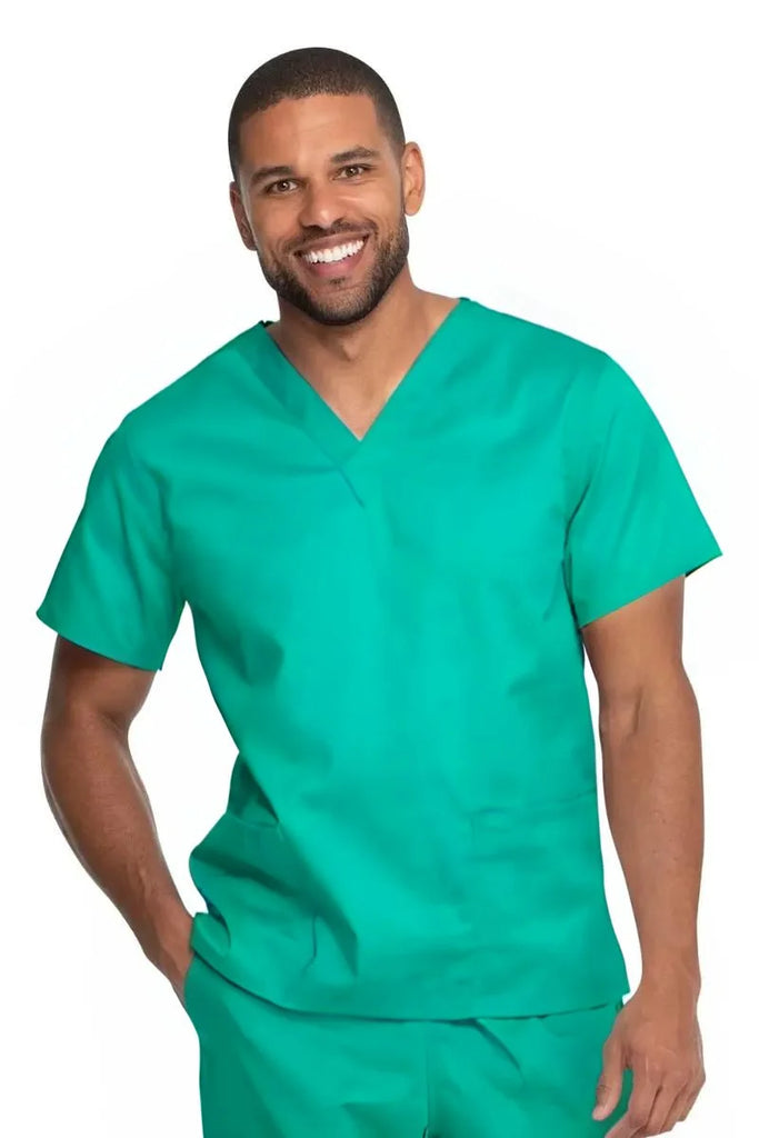 A young male Surgeon wearing a Dickies Industrial Unisex V-Neck Scrub Top in Surgical Green size 5XL featuring a soft and breathable fabric that offers all-day comfort.