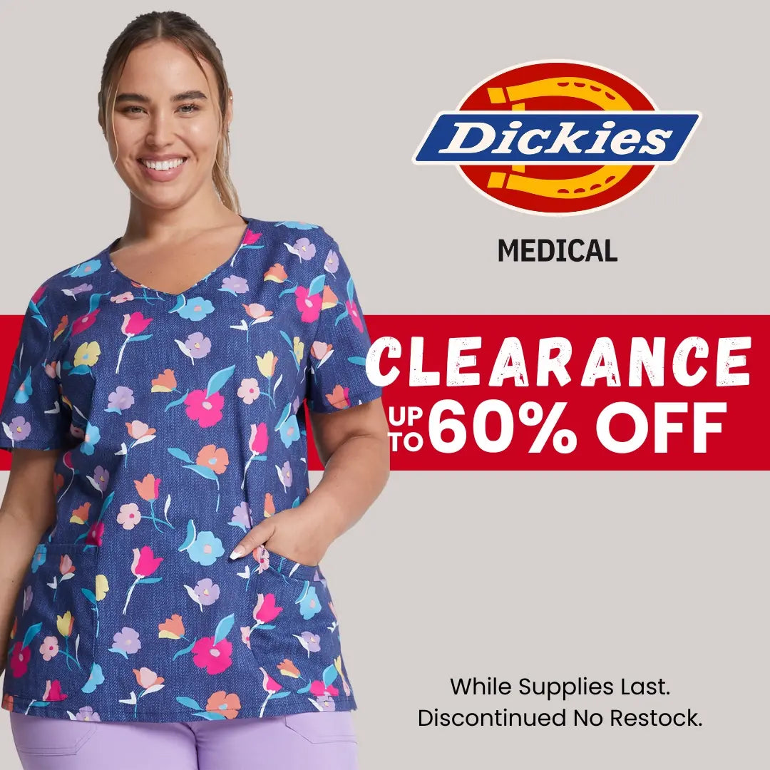 A young female displaying one of the available print scrub tops from Scrub Pro Uniforms' collection of clearance Dickies Medical Scrubs.