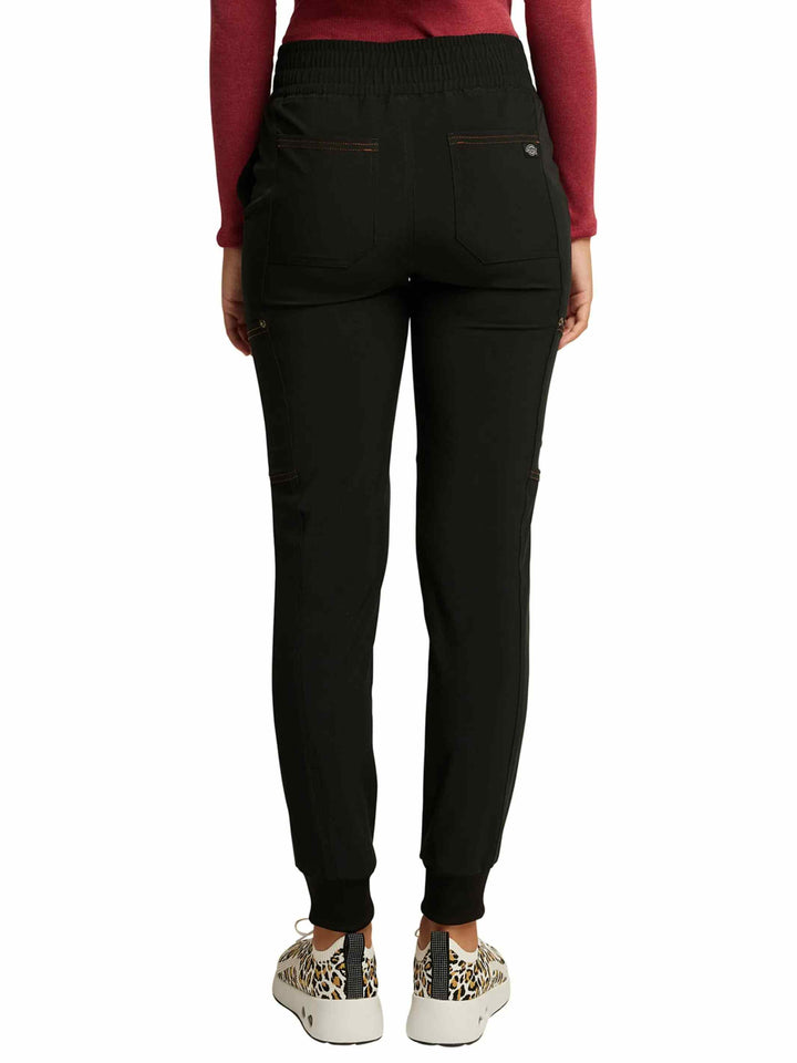 The back of the Dickies Riveting Women's Mid Rise Scrub Jogger in Black featuring contrast copper stitching throughout.