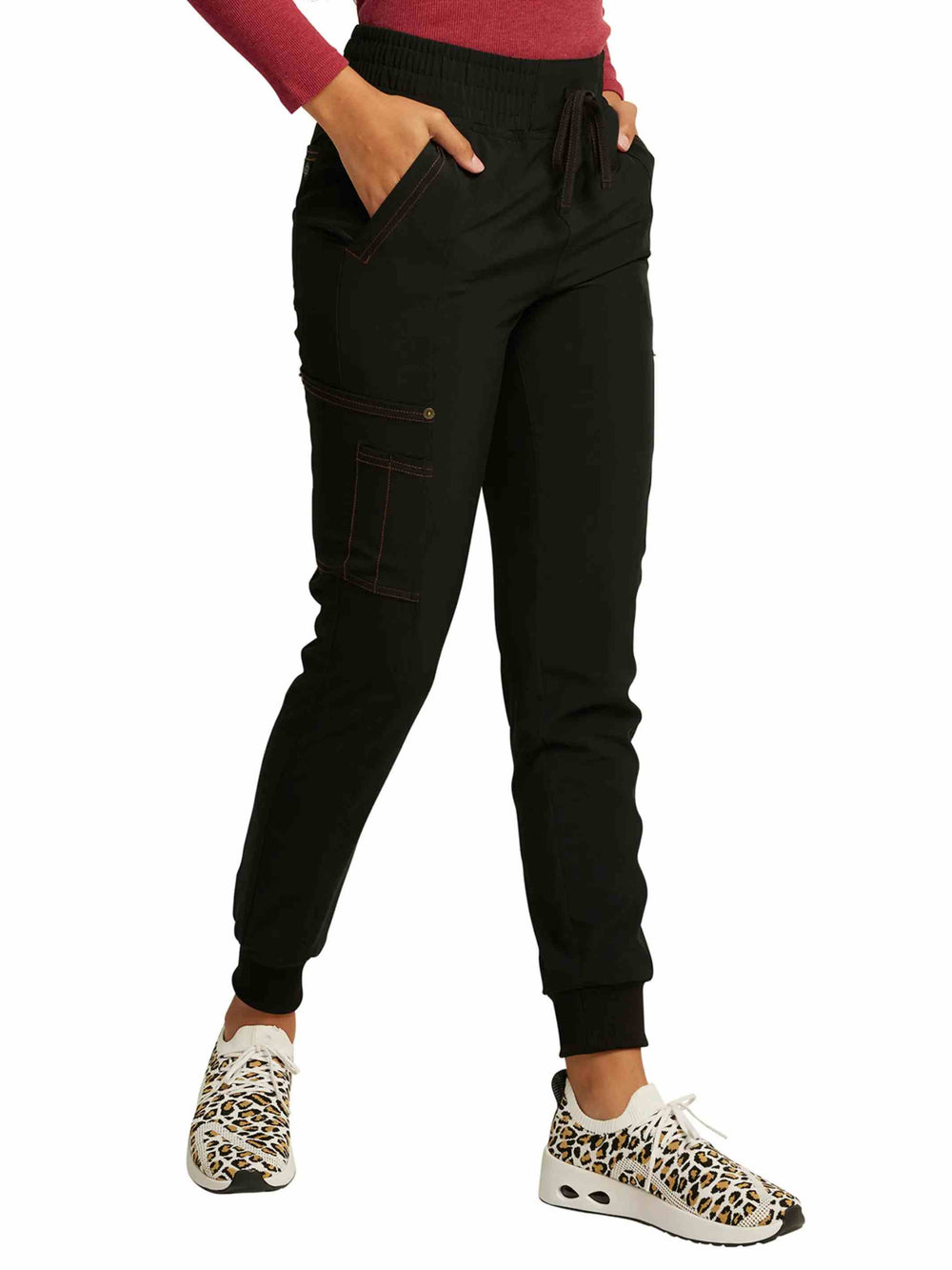 The right side of the Dickies Riveting Women's Mid Rise Scrub Jogger in Black size Medium featuring ankle vents and a tapered leg.