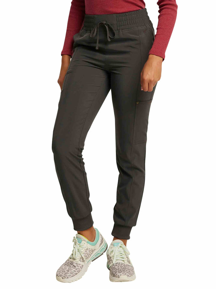 The left side of the Dickies Riveting Women's Mid Rise Scrub Jogger in Pewter featuring ankle cuffs and a tapered leg.