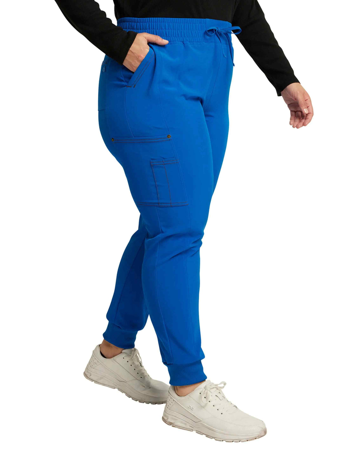 A look at the right side of the Dickies Riveting Women's Mid Rise Scrub Joggers in Royal Blue size 2XL featuring a total of 6 pockets and one double pen slot.