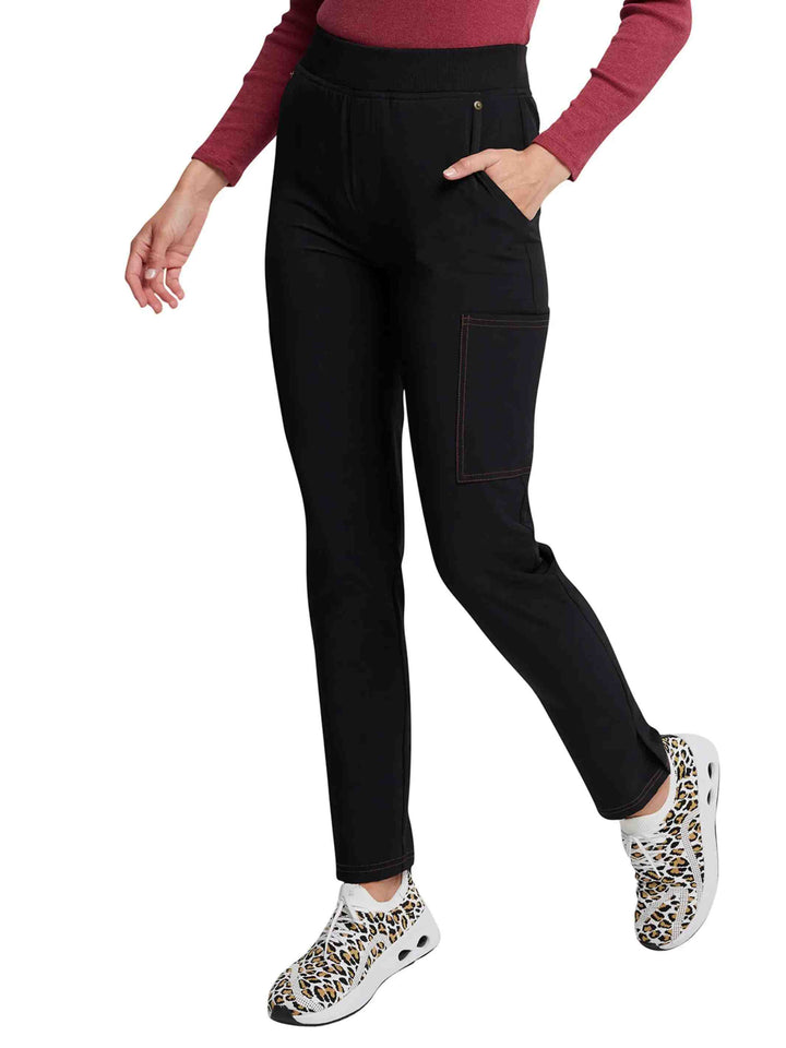 The left side of the Dickies Riveting Women's Mid Rise Pull On Scrub Pants in Black featuring ankle vents.