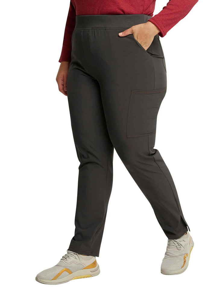 A look at the right side of the Dickies Riveting Women's Mid-Rise Pull On Scrub Pants in Pewter featuring ankle vents.