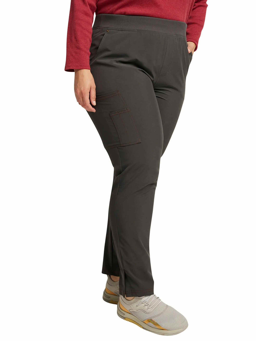 A lab tech showcasing the right side of the Dickies Riveting Women's Pull On Scrub Pant in Pewter featuring an elastic waist with an interior drawstring.