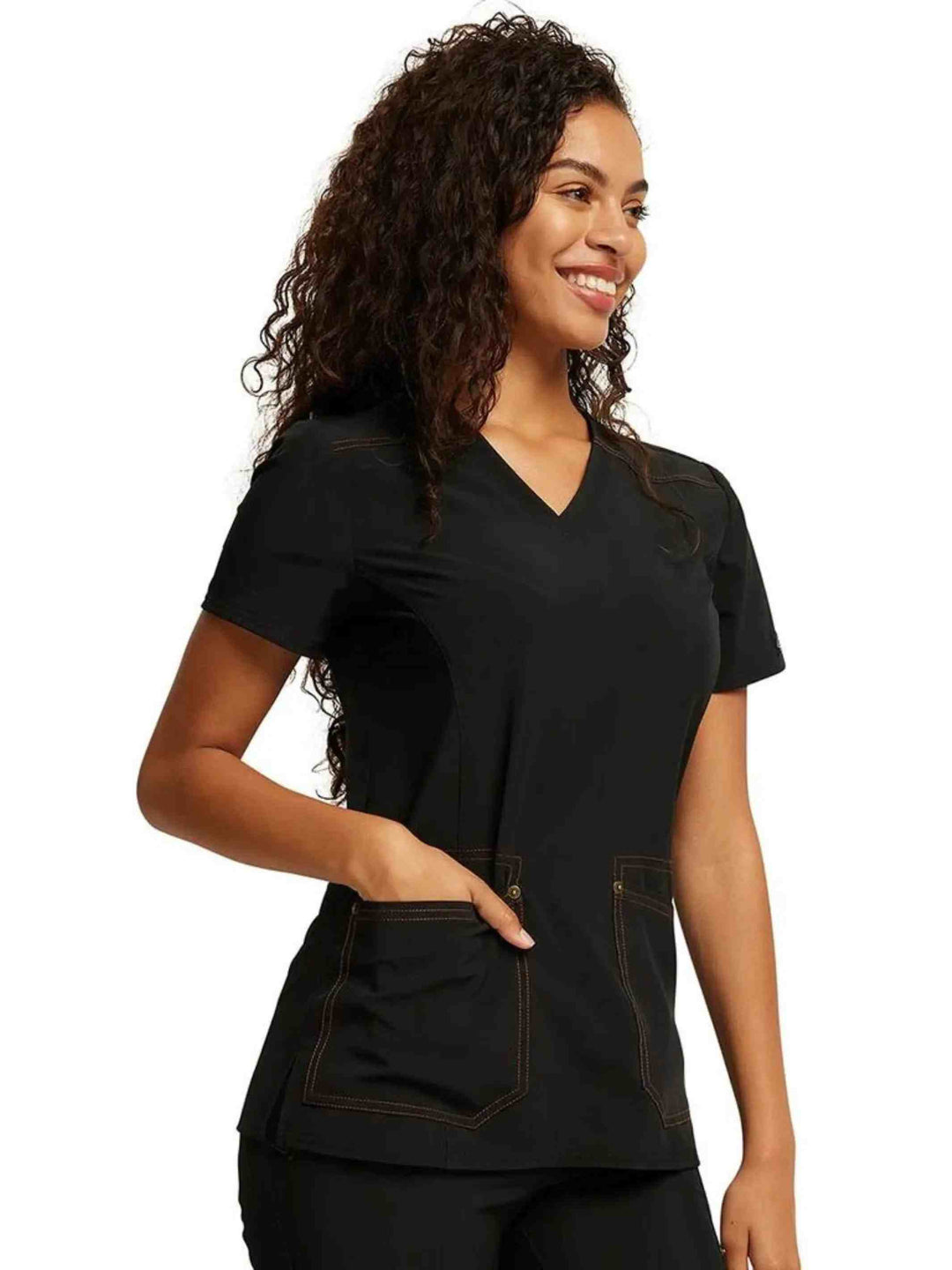 A look at the right side of the Dickies Riveting Women's V-neck Scrub Top in Black featuring two front patch pockets.