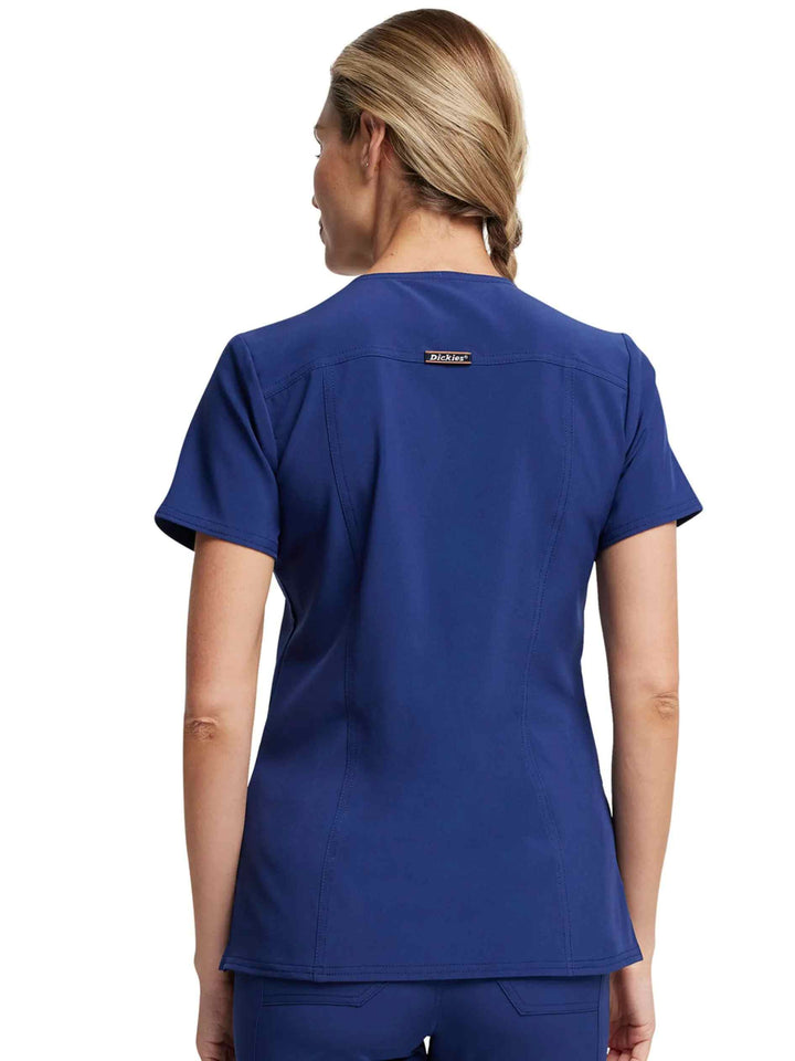 The back of the Dickies Riveting Women's V-neck Scrub Top in Navy Blue featuring a locker loop at the back yoke.