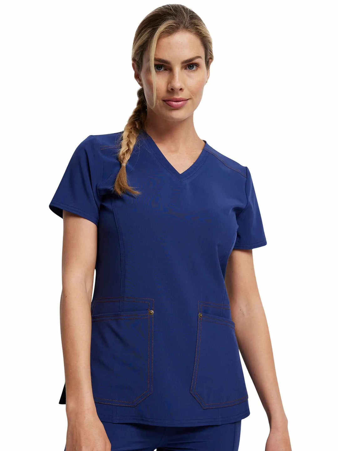 A young female Nurse Practitioner wearing the Dickies Riveting Women's V-neck Scrub Top in Navy Blue featuring short sleeves.