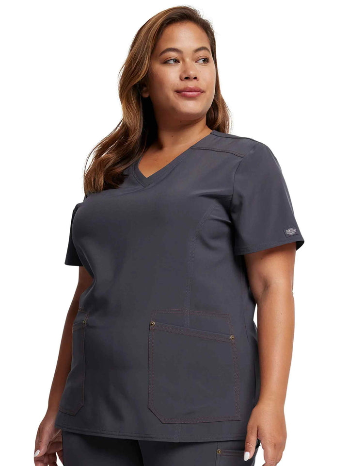 A look at the left side of the Dickies Riveting Women's V-neck Scrub Top in Pewter size 2XL featuring two front patch pockets.