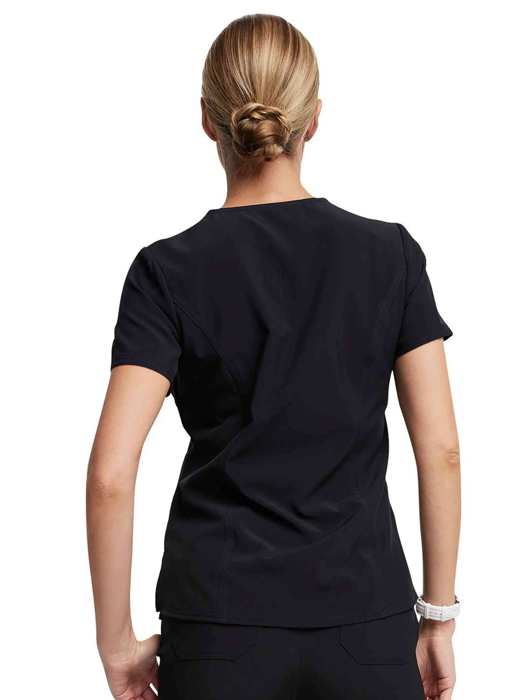 A look at the back of the Dickies Riveting Women's Tuckable Scrub Top in Black size Medium featuring a center back length of 26.75".