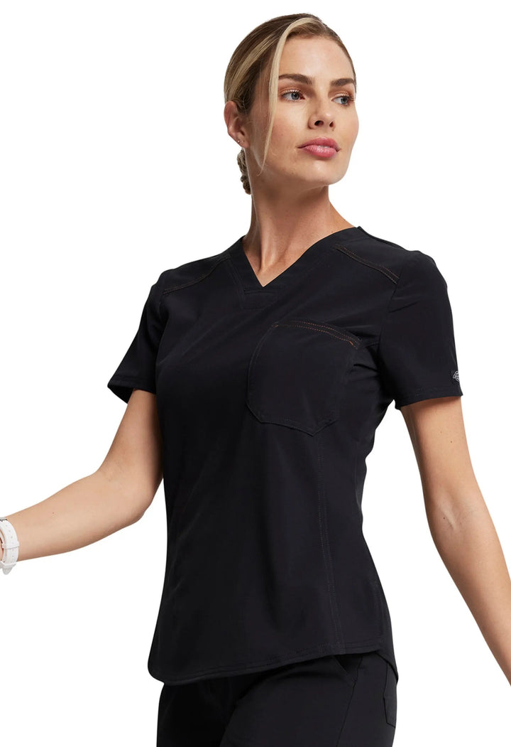 A look at the left side of the Dickies Riveting Women's Tuckable Scrub Top in Black size Large featuring logo rivets at the sleeves.