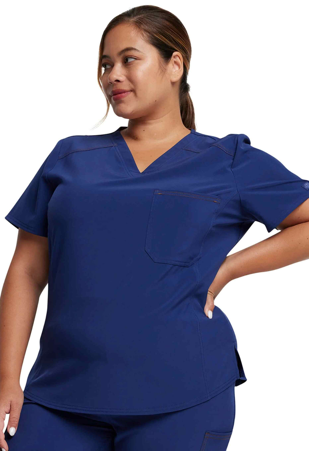 A look at the right side of the Dickies Riveting Women's Tuckable Scrub Top in Navy Blue featuring a V-neckline.