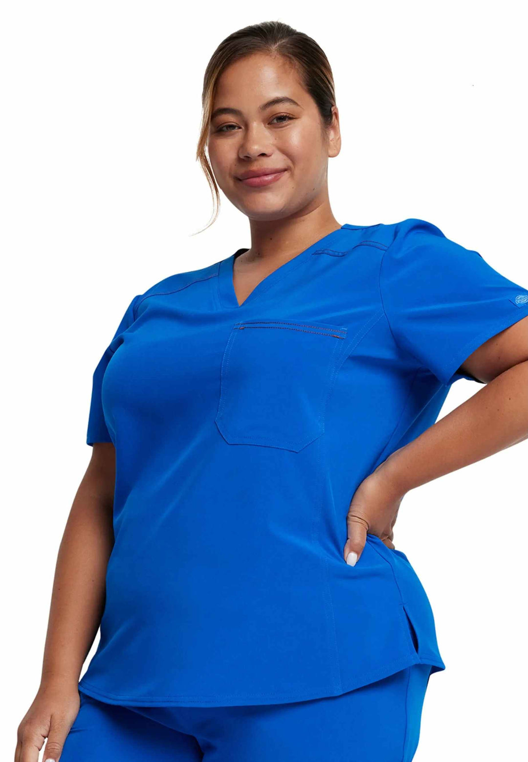 A look at the left side of the Dickies Riveting Women's Tuckable Scrub Top in Royal Blue featuring one front chest pocket.