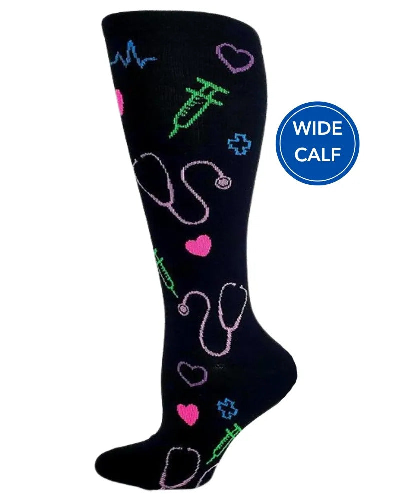 Foot mannequin displaying Pro-Motion Women's Wide Calf Compression Socks in black with medical symbols such as stethoscopes & syringes featuring a calf size of 17"-21".