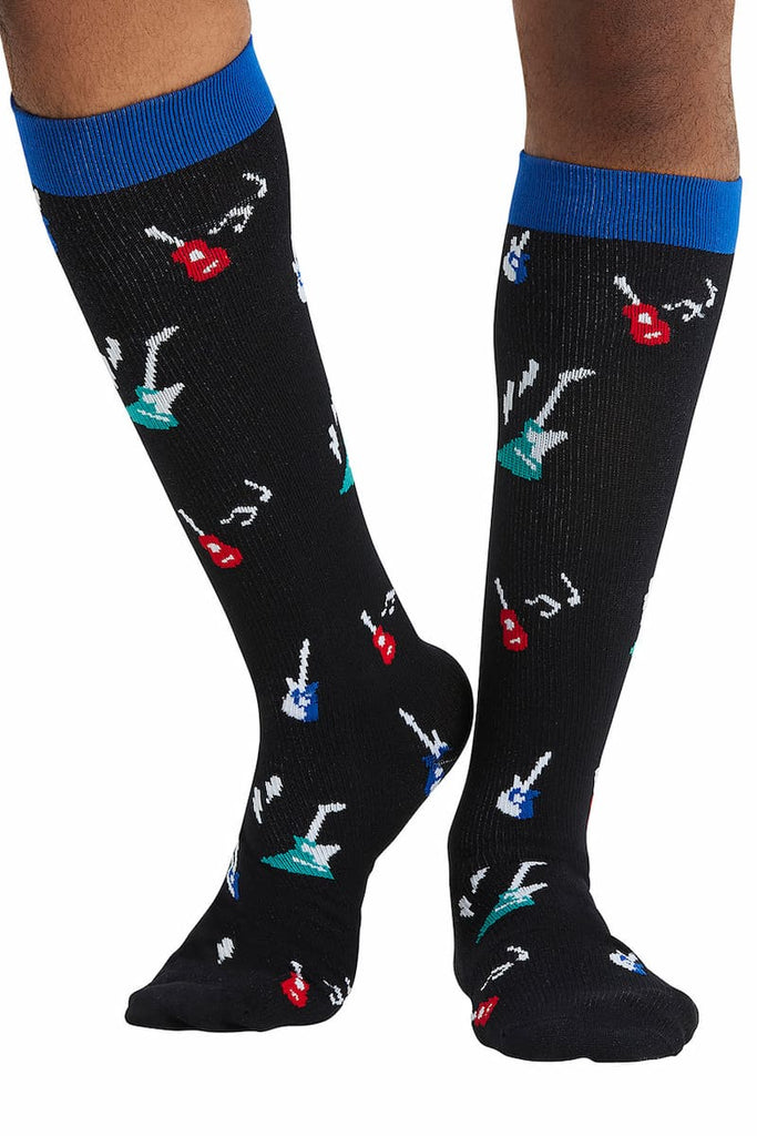 The front of the Cherokee Men's Printed Support Socks in Guitar Hero featuring a unique print with red and blue guitars scattered across a solid black background.