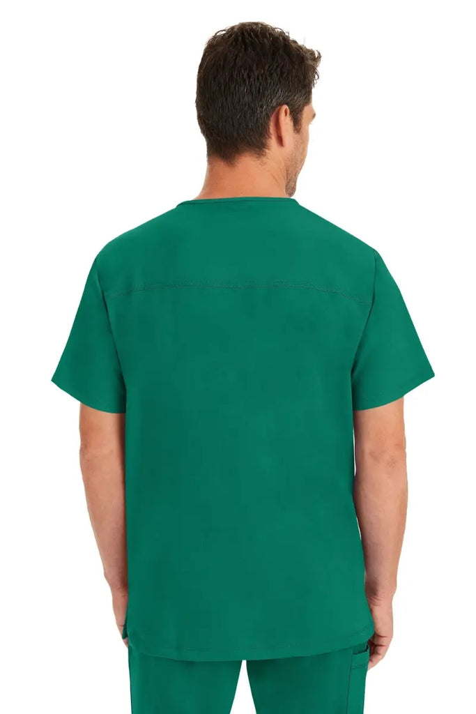 A male Nurse wearing a Men's Matthew V-Neck Scrub Top from HH Works in Hunter Green featuring a center back length of 28".