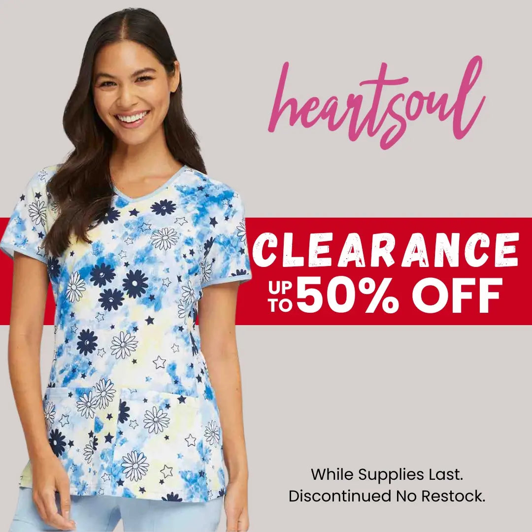 A young female Pediatric Nurse wearing a print scrub top from Scrub Pro's collection of HeartSoul clearance items.