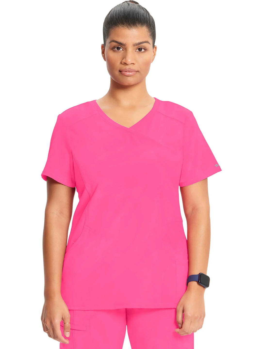 A young female Maternity Nurse displaying the front of the Infinity Women's Mock Wrap Antimicrobial Scrub Top in Carmine Pink on a white background.