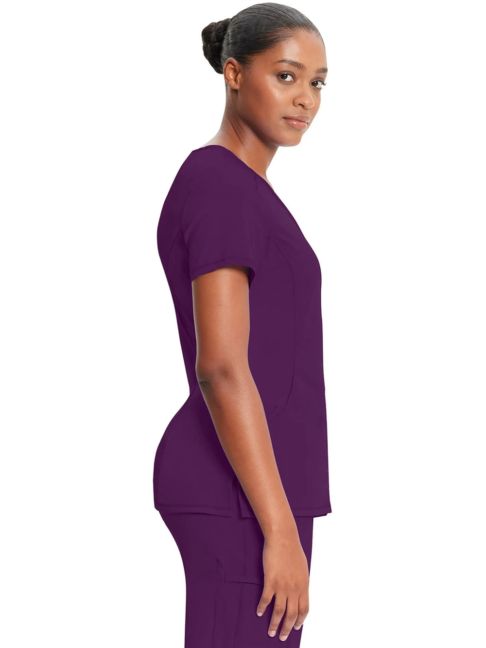 A look at the side of the Infinity Women's Mock Wrap Scrub Top (2625A) in Eggplant featuring short sleeves.