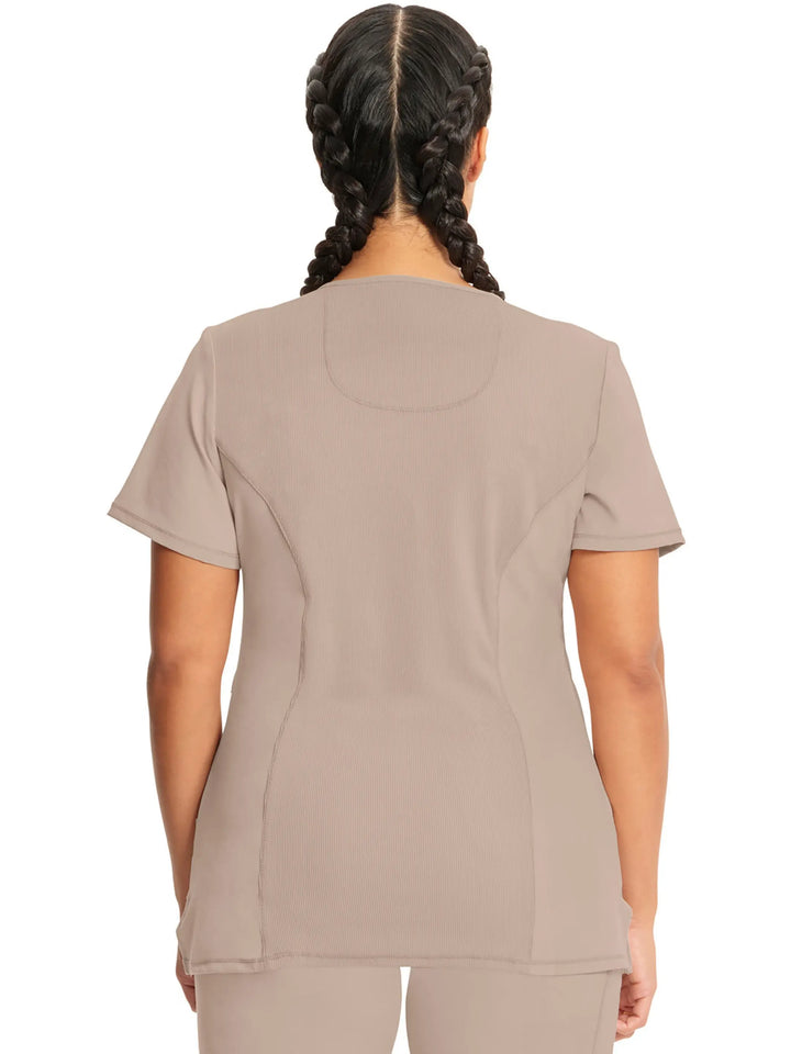 A look at the back of the Infinity Women's Mock Wrap Antimicrobial Scrub Top in Khaki size medium featuring a center back length of 26" and stylish seaming throughout.