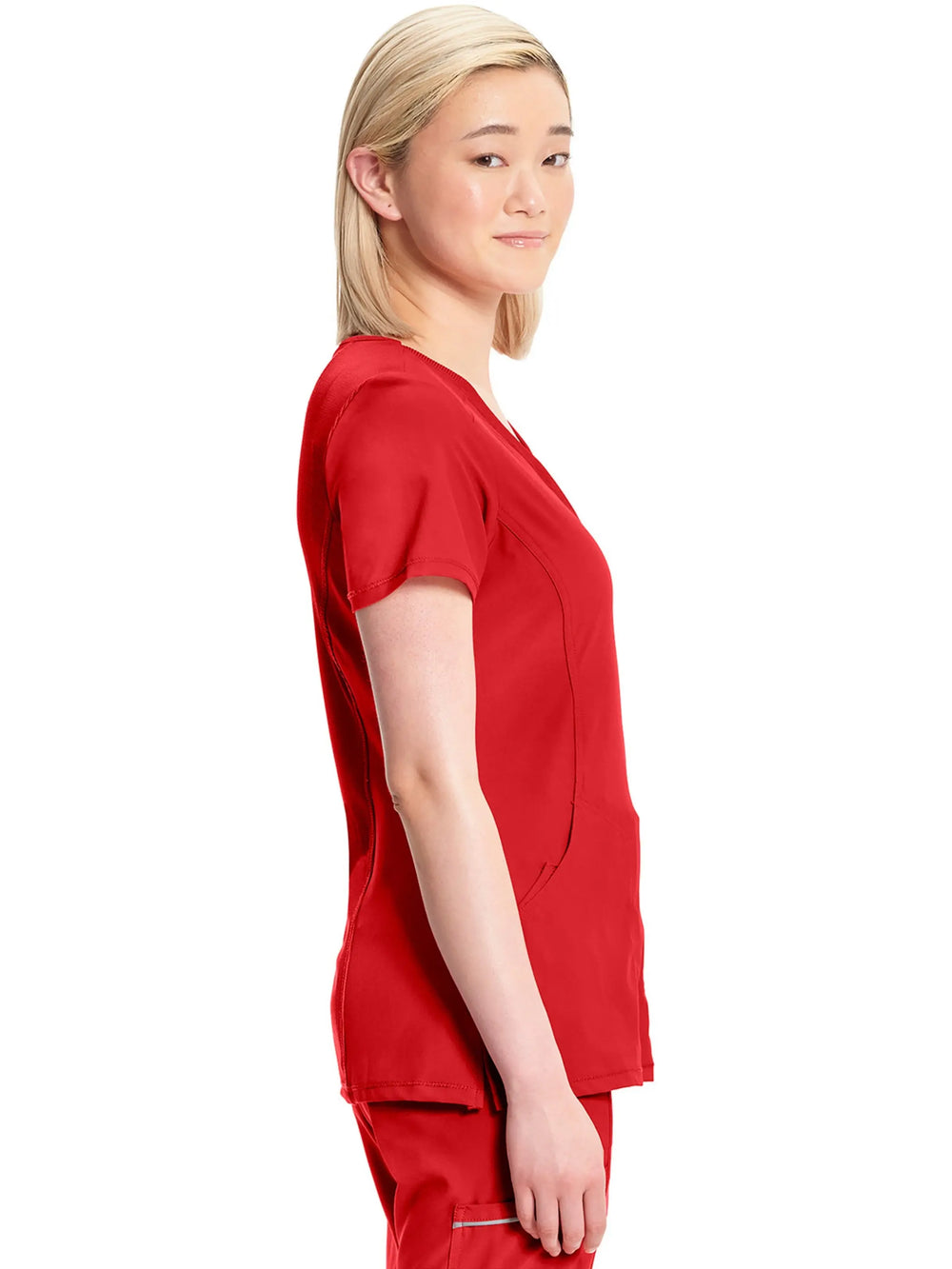 A look at the side of the Infinity Women's Mock Wrap Scrub Top (2625A) in Red featuring short sleeves and side slits.