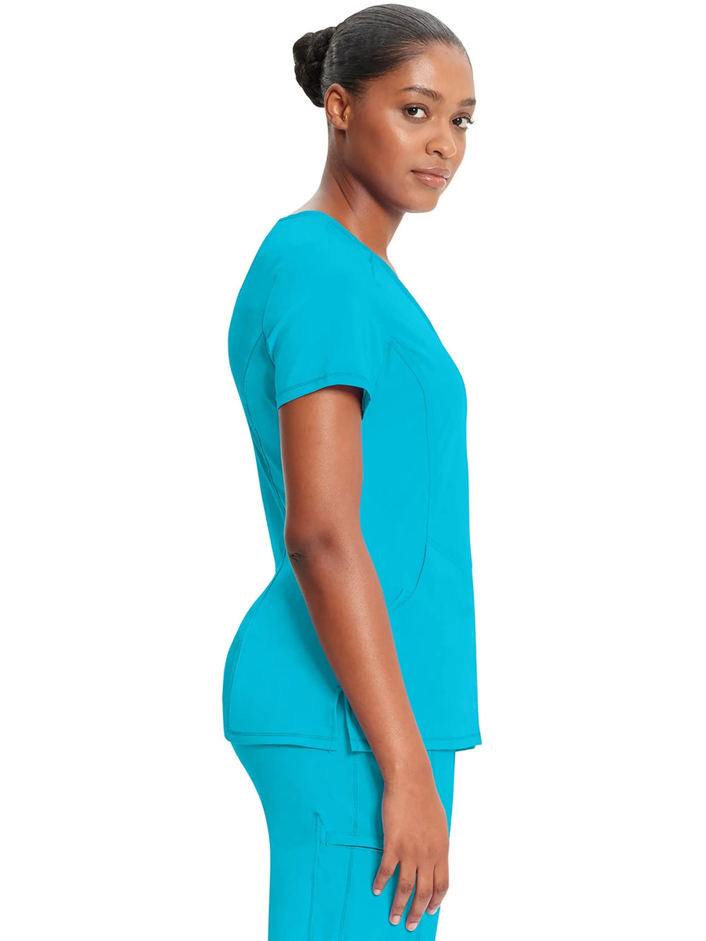 A look at the side of the Infinity Women's Mock Wrap Scrub Top (2625A) in Turquoise Blue featuring short sleeves.