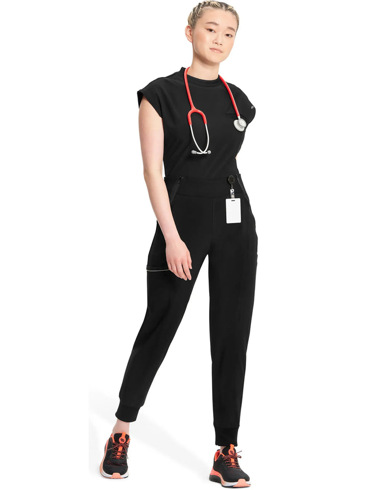 A young female EMT wearing an Infinity Women's Tapered Jogger Scrub Pant in Black size small featuring a total of 5 pockets.